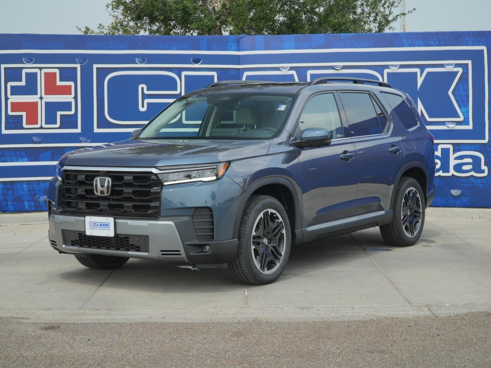 2026 Honda Pilot Touring Blackout in Smoke Blue Pearl — front three-quarter view