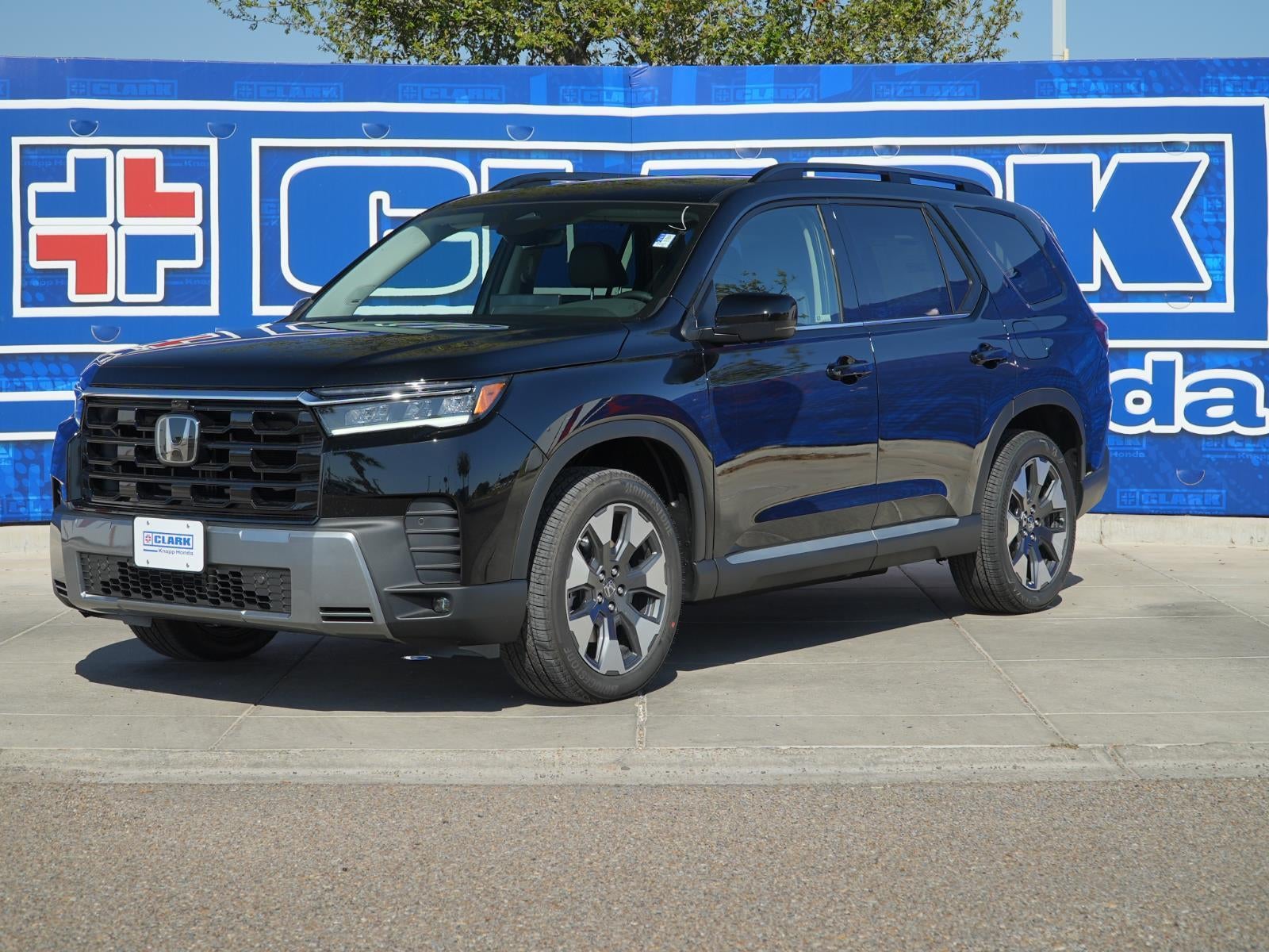 2026 Honda Pilot Touring in Crystal Black Pearl — front three-quarter view