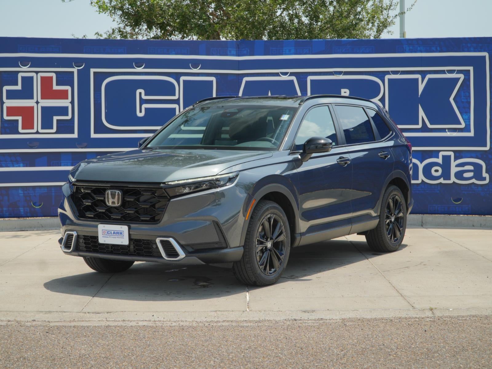 2026 Honda CR-V Hybrid Sport Touring in Meteorite Gray Metallic — front three-quarter view